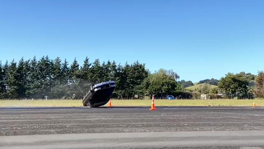 Wide landing shot from nitrogen-powered rollover testing.